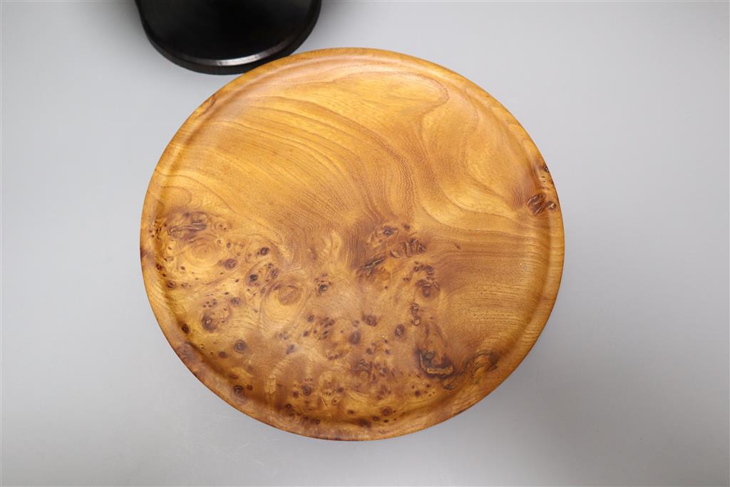 A burr yew bowl by Peter Spear, a carved hardwood stand and an ebony dish